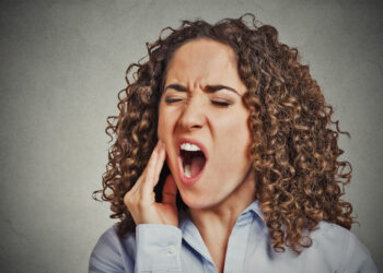 Periodontinis pūlinys: simptomai, priežastys ir gydymas