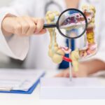 Perteklinis dvitaškis: simptomai, priežastys ir gydymas